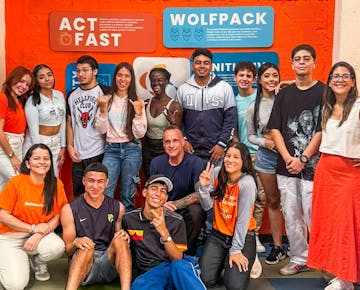 A diverse group of International Volunteer HQ volunteers and Colombian youth smiling together while attending the teaching English and Youth Development program in Colombia.