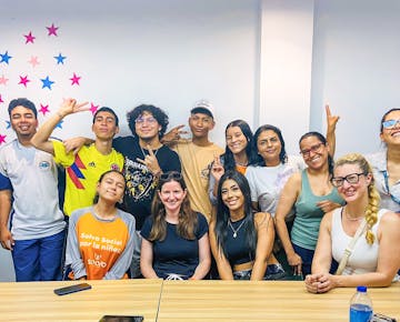 A diverse group of International Volunteer HQ volunteers and Colombian youth smiling together while attending the teaching English and Youth Development program in Colombia.