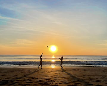 Volunteers enjoying the beach at sunset in Costa Rica with IVHQ