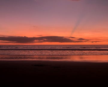 Sunset in Costa Rica with IVHQ volunteers