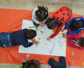 Children drawing at the IVHQ teaching volunteer project in Rome, Italy