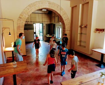 Volunteers and children dancing on the Youth Support project in Rome, Italy with IVHQ