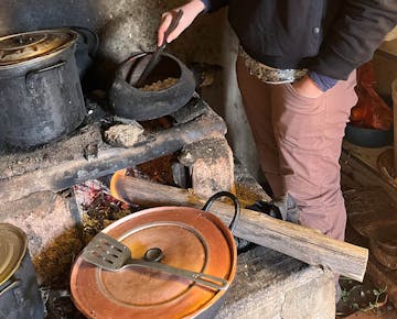 IVHQ volunteer cooking traditional food on Andean Immersion project in Cusco