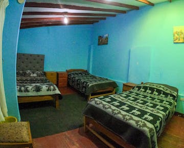 Volunteer bedroom in Cusco, Peru with IVHQ