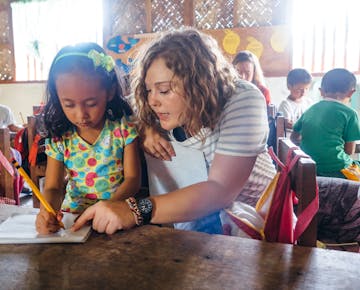 An IVHQ volunteer abroad in the Philippines working in kindergarten
