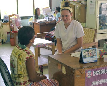 IVHQ volunteer helping patient with health consultation at the Healthcare project in Philippines
