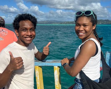Volunteers having fun on the IVHQ add on boat tour in Trinidad and Tobago
