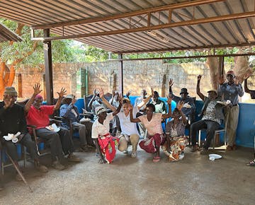 Volunteers having a joyful time with the elders at the childcare project in Zambia with IVHQ